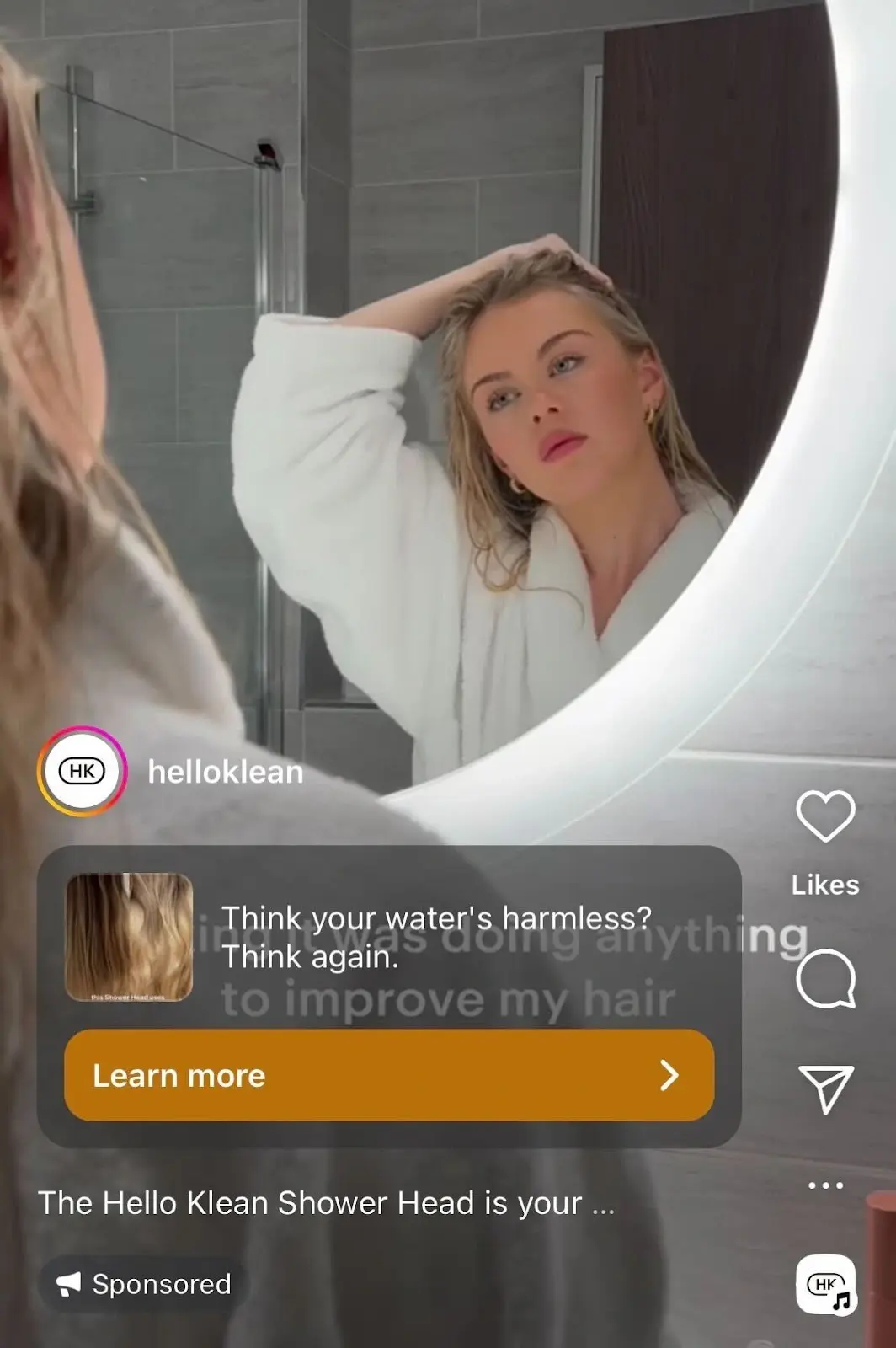 Screenshot of sponsored ad on instagram from helloklean of a woman in a white bathrobe staring blankly at herself in a bathroom mirror.