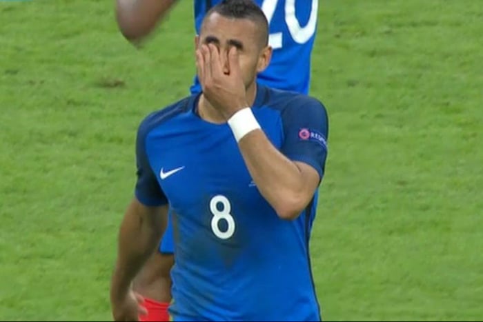 Football player scratching his eyes